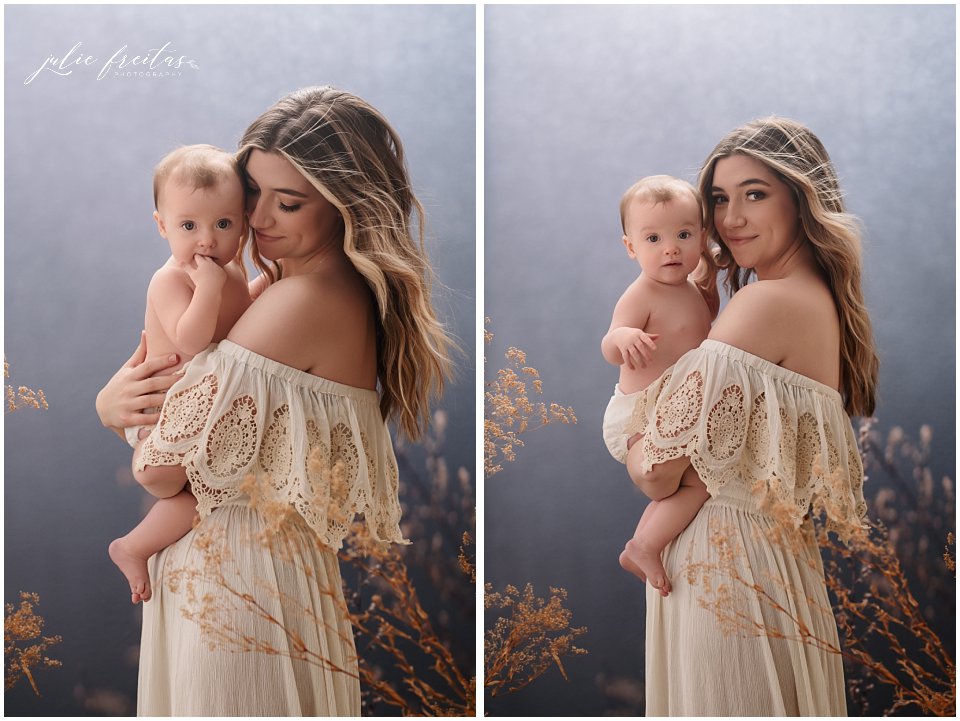 mother in cream lace dress cradling her baby