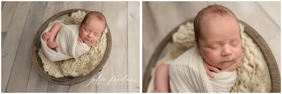 newborn baby wrapped in cream swaddle posed in a wooden bowl
